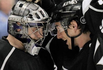 LOS ANGELES, CA - APRIL 11:  Peter Harrold #5 (R) defensman of the Los Angeles Kings congratulates goalie Jonathan Quick #32 after defeating the San Jose Sharks, 4-3, on April 11, 2009 on April 11, 2009 at the Staples Center in Los Angeles, California.  (Photo by Kevork Djansezian/Getty Images)