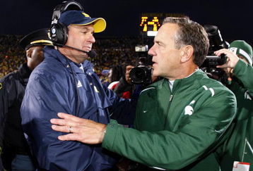 ANN ARBOR, MI - OCTOBER 25: Head coach Mark Dantonio of the Michigan State Spartans shakes hands with head coach Rich Rodriguez of the Michigan Wolverines after a Michigan State 35-21 victory on October 25, 2008 at Michigan Stadium in Ann Arbor, Michigan.  (Photo by Gregory Shamus/Getty Images)