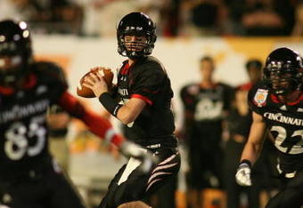 MIAMI - JANUARY 01: Tony Pike #15 of the Cincinnati Bearcats looks down field to pass against the Virginia Tech Hokies during the FedEx Orange Bowl at Dolphin Stadium on January 1, 2009 in Miami, Florida.  (Photo by Marc Serota/Getty Images)