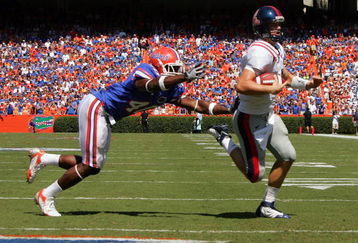 GAINESVILLE, FL - SEPTEMBER 27:  Quarterback Jevan Snead #4 of the Ole Miss Rebels runs for a touchdown against Brnadon Hicks #40 of the Florida Gators during the game at Ben Hill Griffin Stadium on September 27, 2008 in Gainesville, Florida.  (Photo by Sam Greenwood/Getty Images)