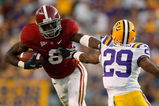 BATON ROUGE, LA - NOVEMBER 08:  Julio Jones #8 of the Alabama Crimson Tide avoids a tackle by Chris Hawkins #29 of the Louisiana State University Tigers  on November 11, 2008 at Tiger Stadium in Baton Rouge, Louisiana. The Tide defeated the Tigers 27-21 in overtime.  (Photo by Chris Graythen/Getty Images)