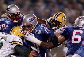 27 Oct 1997:  Quarterback Drew Bledsoe of the New England Patriots gets sacked during a game against the Green Bay Packers at Foxboro Stadium in Foxboro, Massachusetts. Mandatory Credit: Al Bello  /Allsport