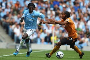MANCHESTER, UNITED KINGDOM - AUGUST 22: Michael Mancienne of Wolverhampton Wanderers competes for the ball with Emmanuel Adebayor of Manchester City during the Barclays Premier League match between Manchester City and Wolverhampton Wanderers at the City of Manchester Stadium on August 22, 2009 in Manchester, England. (Photo by Jamie McDonald/Getty Images)