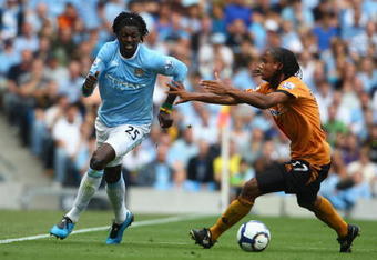 MANCHESTER, UNITED KINGDOM - AUGUST 22:   Michael Mancienne of Wolverhampton Wanderers competes for the ball with Emmanuel Adebayor of Manchester City during the Barclays Premier League match between Manchester City and Wolverhampton Wanderers at the City of Manchester Stadium on August 22, 2009 in Manchester, England. (Photo by Jamie McDonald/Getty Images)