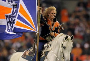 DENVER - AUGUST 30:  Ann Judge Wegener rides Thunder in celebration of a touchdown by the Denver Broncos against the Chicago Bears during preseason NFL action at INVESCO Field at Mile High on August 30, 2009 in Denver, Colorado. The Bears defeated the Broncos 27-17.  (Photo by Doug Pensinger/Getty Images)