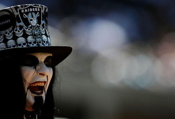 OAKLAND, CA - AUGUST 29:  A fan of the Oakland Raiders watches the preseason game against the New Orleans Saints at Oakland-Alameda County Coliseum on August 29, 2009 in Oakland, California. (Photo by Jed Jacobsohn/Getty Images)