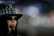OAKLAND, CA - AUGUST 29: A fan of the Oakland Raiders watches the preseason game against the New Orleans Saints at Oakland-Alameda County Coliseum on August 29, 2009 in Oakland, California. (Photo by Jed Jacobsohn/Getty Images)