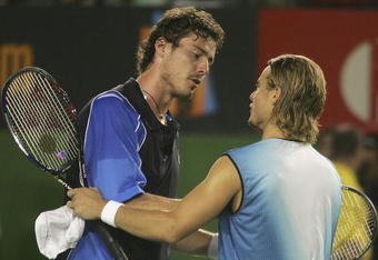 MELBOURNE, AUSTRALIA - JANUARY 30: Lleyton Hewitt of Australia shakes hands with Marat Safin of Russia after the Men's Final during day fourteen of the Australian Open Grand Slam at Melbourne Park January 30, 2005 in Melbourne, Australia. (Photo by Sean Garnsworthy/Getty Images)
