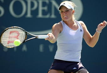 NEW YORK - SEPTEMBER 03:  Melanie Oudin returns a shot against Elena Dementieva of Russia during day four of the 2009 U.S. Open at the USTA Billie Jean King National Tennis Center on September 3, 2009 in Flushing neighborhood of the Queens borough of New York City.  (Photo by Al Bello/Getty Images)