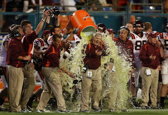 MIAMI - JANUARY 01:  Head coach Frank Beamer of the Virginia Tech Hokies gets gatorade dump on him by his players on their way to winning against the Cincinnati Bearcats during the FedEx Orange Bowl at Dolphin Stadium on January 1, 2009 in Miami, Florida.  (Photo by Doug Benc/Getty Images)