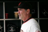 SAN FRANCISCO - AUGUST 30:  San Francisco Giants manager Bruce Bochy #15 stands in the dugout before their game against the Colorado Rockies at AT&T Park on August 30, 2009 in San Francisco, California.  (Photo by Ezra Shaw/Getty Images)