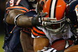 CHICAGO, IL - SEPTEMBER 3: Running back Noah Herron #33 of the Cleveland Browns is tackled by several defenders against the Chicago Bears at Soldier Field on September 3, 2009 in Chicago, Illinois. (Photo by Scott Boehm/Getty Images)