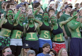 SOUTH BEND, IN - OCTOBER 20: women fans of the Notre Dame Fighting Irish dress in green paint cheer during the game against the University of Southern California Trojans at Notre Dame Stadium October 20, 2007 in South Bend, Indiana. USC defeated Notre Dame 38-0. (Photo by Jonathan Daniel/Getty Images)