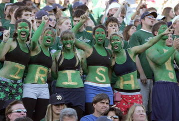 SOUTH BEND, IN - OCTOBER 20: women fans of the Notre Dame Fighting Irish dress in green paint cheer during the game against the University of Southern California Trojans at Notre Dame Stadium October 20, 2007 in South Bend, Indiana. USC defeated Notre Dame 38-0. (Photo by Jonathan Daniel/Getty Images)