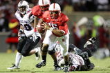 RALEIGH, NC - SEPTEMBER 3:  Quarterback Russell Wilson #16 of the North Carolina State Wolfpack runs with the ball against the South Carolina Gamecocks during the game at Carter-Finley Stadium on September 3, 2009 in Raleigh, North Carolina. (Photo by Streeter Lecka/Getty Images)