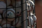 ANAHEIM, CA - AUGUST 11:  A basket of baseballs for batting practice sits on the field before the game betwee  the Los Angeles Angels of Anaheim the Tampa Bay Rays on August 11, 2009 at Angel Stadium in Anaheim, California.  (Photo by Stephen Dunn/Getty Images)