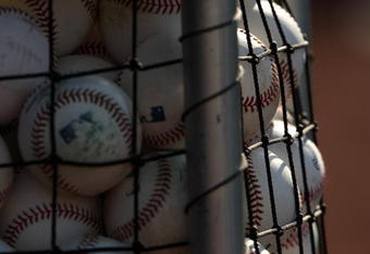 ANAHEIM, CA - AUGUST 11:  A basket of baseballs for batting practice sits on the field before the game betwee  the Los Angeles Angels of Anaheim the Tampa Bay Rays on August 11, 2009 at Angel Stadium in Anaheim, California.  (Photo by Stephen Dunn/Getty Images)