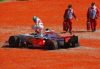 MELBOURNE, AUSTRALIA - MARCH 16:  Giancarlo Fisichella of Italy and Force India ends up in the gravel at the first corner at the start of the Australian Formula One Grand Prix at the Albert Park Circuit on March 16, 2008 in Melbourne, Australia.  (Photo by Mark Thompson/Getty Images)