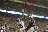GLENDALE, AZ - FEBRUARY 03:  David Tyree #85 of the New York Giants and Randy Moss #81 of the New England Patriots leap for a pass during Super Bowl XLII on February 3, 2008 at the University of Phoenix Stadium in Glendale, Arizona.  (Photo by Donald Miralle/Getty Images)