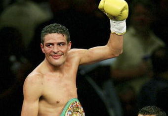 LAS VEGAS - JULY 16:  Oscar Larios celebrates his victory against Wayne McCullough after their super bantamweight championship fight at the MGM Grand Garden Arena on July 16, 2005 in Las Vegas, Nevada. Larios won the fight by TKO in the 10th round.  (Photo by Ethan Miller/Getty Images)
