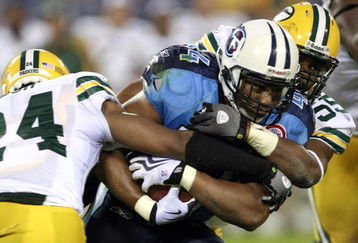 NASHVILLE, TN - SEPTEMBER 3: Rodney Ferguson #44 of the Tennessee Titans is tackled by Jarrett Bush #24 and Desmond Bishop #55 of the Green Bay Packers during a preseason NFL game at LP Field on September 3, 2009 in Nashville, Tennessee. The Titans beat the Packers 27-13. (Photo by Joe Murphy/Getty Images)