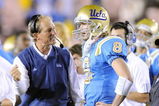 PASADENA, CA - NOVEMBER 08:  Head coach Rick Neuheisel talks with Chris Forcier #8 of the UCLA Bruins during the game against the Oregon State Beavers at the Pasadena Rose Bowl on November 8, 2008 in Pasadena, California.  (Photo by Lisa Blumenfeld/Getty Images)
