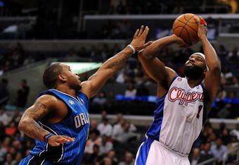 LOS ANGELES, CA - DECEMBER 08:  Baron Davis #1 of the Los Angeles Clippers shoots a jumper over Jameer Nelson #14 of the Orlando Magic at the Staples Center on December 8, 2008 in Los Angeles, California.   NOTE TO USER: User expressly acknowledges and agrees that, by downloading and/or using this Photograph, user is consenting to the terms and conditions of the Getty Images License Agreement.  (Photo by Harry How/Getty Images)