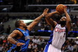 LOS ANGELES, CA - DECEMBER 08:  Baron Davis #1 of the Los Angeles Clippers shoots a jumper over Jameer Nelson #14 of the Orlando Magic at the Staples Center on December 8, 2008 in Los Angeles, California.   NOTE TO USER: User expressly acknowledges and agrees that, by downloading and/or using this Photograph, user is consenting to the terms and conditions of the Getty Images License Agreement.  (Photo by Harry How/Getty Images)