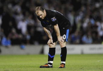 BURNLEY, ENGLAND - AUGUST 19:  Wayne Rooney of Manchester United looks dejected after the Barclays Premier League match between Burnley and Manchester United at Turf Moor on August 19, 2009 in Burnley, England.  (Photoby Laurence Griffiths/Getty Images)