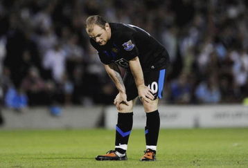 BURNLEY, ENGLAND - AUGUST 19:  Wayne Rooney of Manchester United looks dejected after the Barclays Premier League match between Burnley and Manchester United at Turf Moor on August 19, 2009 in Burnley, England.  (Photoby Laurence Griffiths/Getty Images)