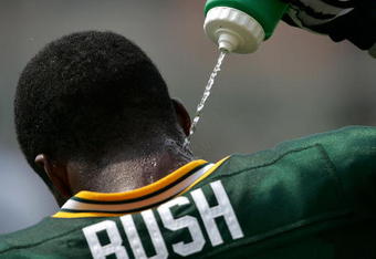 GREEN BAY, WI - AUGUST 6:  Jarrett Bush #24 of the Green Bay Packers squirts water on his neck during summer training camp practice on August 6, 2007 at the Hutson Center in Green Bay, Wisconsin.  (Photo by Jonathan Daniel/Getty Images)