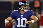 EAST RUTHERFORD, NJ - AUGUST 29:  Eli Manning #10 of the New York Giants looks to throw a pass against the New York Jets on August 29, 2009 at Giants Stadium in East Rutherford, New Jersey.  (Photo by Jim McIsaac/Getty Images)