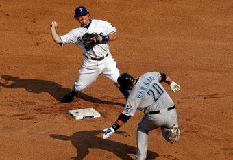 ARLINGTON, TX - SEPTEMBER 01:  Second baseman Ian Kinsler #5 of the Texas Rangers makes the out against Rod Barajas #20 of the Toronto Blue Jays on September 1, 2009 at Rangers Ballpark in Arlington, Texas.  (Photo by Ronald Martinez/Getty Images)