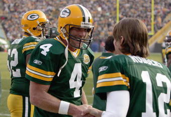 GREEN BAY, WI - NOVEMBER 11: Brett Favre #4 of the Green Bay Packers talks with  Aaron Rodgers #12 during the game against the Minnesota Vikings give chase on November 11, 2007 at Lambeau Field in Green Bay, Wisconsin. (Photo by Jonathan Daniel/Getty Images)