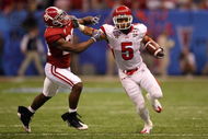 NEW ORLEANS - JANUARY 02:  Wide receiver Brent Casteel #5 of the Utah Utes attempts to avoid a tackle by Javier Arenas #28 of the Alabama Crimson Tide during the 75th Allstate Sugar Bowl at the Louisiana Superdome on January 2, 2009 in New Orleans, Louisiana. The Utes defeated the Tide 31-17. (Photo by Matthew Stockman/Getty Images)