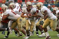 MIAMI - OCTOBER 04:  Quarterback Christian Ponder #7 of the Florida State Seminoles prepares to hand the ball off against the Miami Hurricanes at Dolphin Stadium on October 4, 2008 in Miami, Florida. Florida State defeated Miami 41-39.  (Photo by Doug Benc/Getty Images)