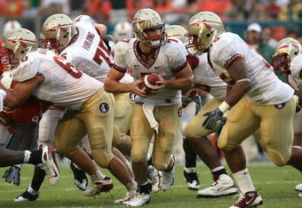 MIAMI - OCTOBER 04:  Quarterback Christian Ponder #7 of the Florida State Seminoles prepares to hand the ball off against the Miami Hurricanes at Dolphin Stadium on October 4, 2008 in Miami, Florida. Florida State defeated Miami 41-39.  (Photo by Doug Benc/Getty Images)
