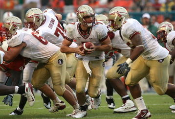 MIAMI - OCTOBER 04:  Quarterback Christian Ponder #7 of the Florida State Seminoles prepares to hand the ball off against the Miami Hurricanes at Dolphin Stadium on October 4, 2008 in Miami, Florida. Florida State defeated Miami 41-39.  (Photo by Doug Benc/Getty Images)