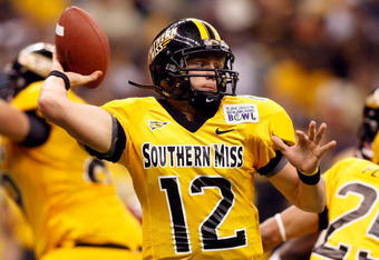NEW ORLEANS - DECEMBER 21: Quarterback Austin Davis #12 of the Southern Mississippi Golden Eagles looks to throw a pass against the Troy Trojans during the R+L Carriers New Orleans Bowl on December 21, 2008 at the Superdome in New Orleans, Louisiana. Davis was named MVP after defeating the Trojans 30-27 in overtime. (Photo by Chris Graythen/Getty Images)
