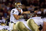 LOS ANGELES, CA - NOVEMBER 29:  Jimmy Clausen #7 of the Notre Dame Fighting Irish calls a play against the USC Trojans during the game at the Coliseum on November 29, 2008 in Los Angeles, California.  (Photo by Harry How/Getty Images)
