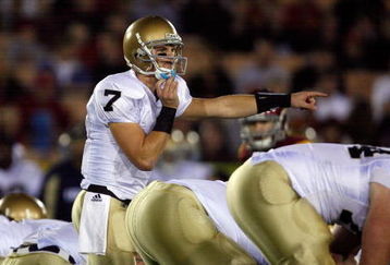 LOS ANGELES, CA - NOVEMBER 29:  Jimmy Clausen #7 of the Notre Dame Fighting Irish calls a play against the USC Trojans during the game at the Coliseum on November 29, 2008 in Los Angeles, California.  (Photo by Harry How/Getty Images)