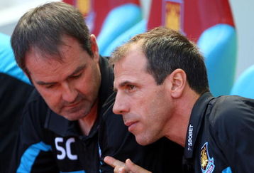 LONDON, ENGLAND - AUGUST 23:  Gianfranco Zola Manager of West Ham United holds a golf ball whilst talking with Steve Clarke during the Barclays Premier League match between West Ham United and Tottenham Hotspur at Upton Park on August 23, 2009 in London, England.  (Photo by Phil Cole/Getty Images)