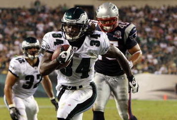 PHILADELPHIA - AUGUST 13:  Eldra Buckley #34 of the Philadelphia Eagles runs in a third quarter touchdown past Rob Ninkovich #45 of the New England Patriots on August 13, 2009 at Lincoln Financial Field in Philadelphia, Pennsylvania.  (Photo by Jim McIsaac/Getty Images)