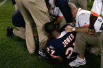 CHICAGO, IL - SEPTEMBER 3: Running back Kevin Jones #27 of the Chicago Bears lays on the sidelines as he is attended to by trainers after an injury against the Cleveland Browns at Soldier Field on September 3, 2009 in Chicago, Illinois. (Photo by Scott Boehm/Getty Images)