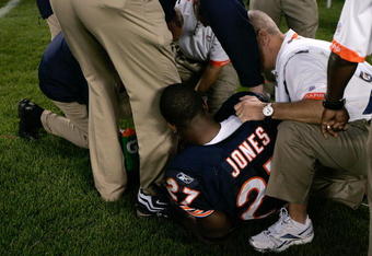 CHICAGO, IL - SEPTEMBER 3: Running back Kevin Jones #27 of the Chicago Bears lays on the sidelines as he is attended to by trainers after an injury against the Cleveland Browns at Soldier Field on September 3, 2009 in Chicago, Illinois. (Photo by Scott Boehm/Getty Images)