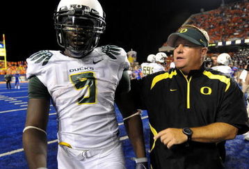 BOISE, ID - SEPTEMBER 3:  LaGarrette Blount #9 of the Oregon Ducks is escorted off the field by head coach Chip Kelly after Blount punched a Boise State Broncos player on September 3, 2009 at Bronco Stadium in Boise, Idaho. Boise State defeated Oregon 19-8.  (Photo by Steve Dykes/Getty Images)
