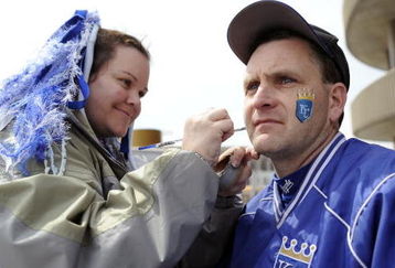 KANSAS CITY, MO - APRIL 10:  A Royals fan has face paint applied during opening day festivities at renovated Kauffman Stadium prior to the New York Yankees against the Kansas City Royals on April 10, 2009 in Kansas City, Missouri. (Photo by G. Newman Lowrance/Getty Images)