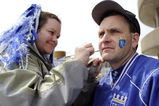 KANSAS CITY, MO - APRIL 10:  A Royals fan has face paint applied during opening day festivities at renovated Kauffman Stadium prior to the New York Yankees against the Kansas City Royals on April 10, 2009 in Kansas City, Missouri. (Photo by G. Newman Lowrance/Getty Images)