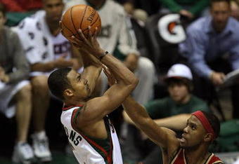 MILWAUKEE - FEBRUARY 20: Ramon Sessions #7 of the Milwaukee Bucks puts up a shot against Daniel Gibson #1 of the Cleveland Cavaliers on February 20, 2009 at the Bradley Center in Milwaukee, Wisconsin. NOTE TO USER: User expressly acknowledges and agreees that, by downloading and/or using this Photograph, User is consenting to the terms and conditions of the Getty Images License Agreement. (Photo by Jonathan Daniel/Getty Images)