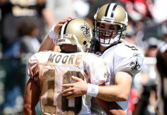 OAKLAND, CA - AUGUST 29:  Quarterback Drew Brees#3 and wide receiver Lance Moore #16 of the New Orleans Saints celebrate a touchdown during the preseason game against the Oakland Raiders at Oakland-Alameda County Coliseum on August 29, 2009 in Oakland, California. (Photo by Jed Jacobsohn/Getty Images)